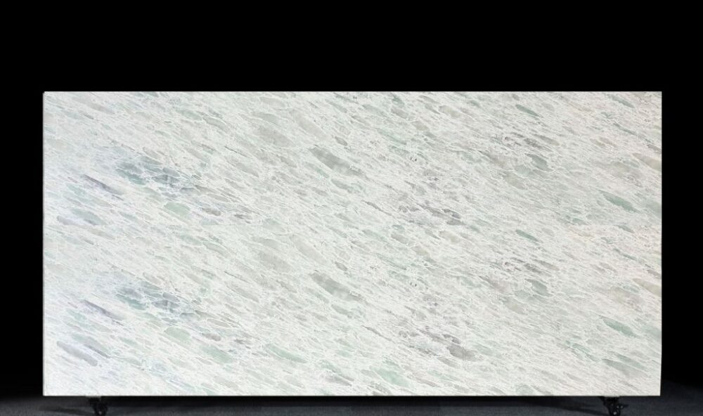 Full slab of T111 Seascape sage green translucent marble look engineered stone at Warner Stone Australia showroom